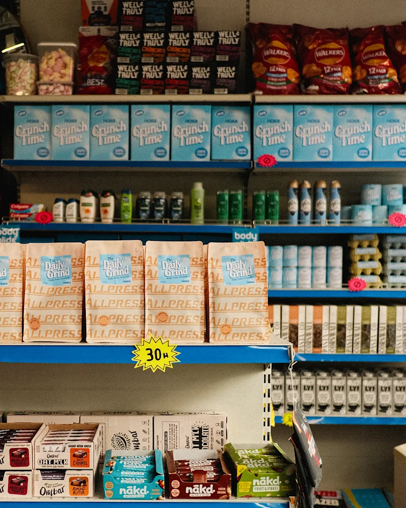 HOKA X Allpress Run shop stop header image of shelves 